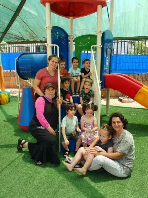 W&J Senior Hailey Nudelman stands in a playground with her students in Israel.